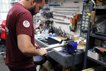 Burnishing a silver trumpet bell.