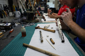 Making adjustments on a flute.