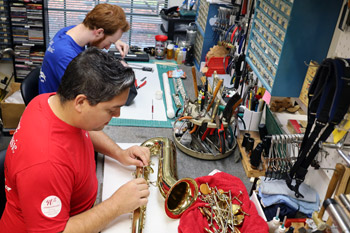 Removing the keys to begin a saxophone overhaul.
